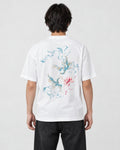 Model wearing the white phoenix and lotus print T-shirt with black jeans, back view