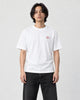 Model wearing the white T-shirt with a small pink lotus on the left chest, front view