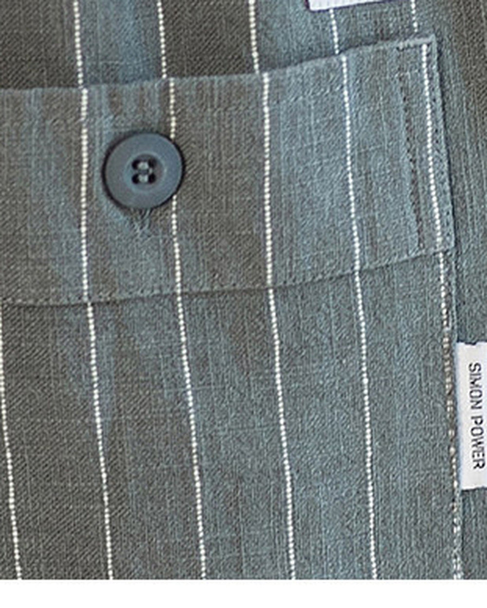 Close-up of the buttoned back pocket and label on the gray pinstripe