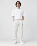Model wearing the off-white pinstripe drawstring pants, front view