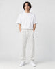Model wearing the off-white pinstripe drawstring pants, front view
