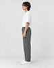 Model wearing the gray pinstripe drawstring pants, side view