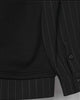 Close-up of the buttoned pinstripe cuff and striped hem band