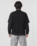 Model wearing the pinstripe layered sweatshirt, back view