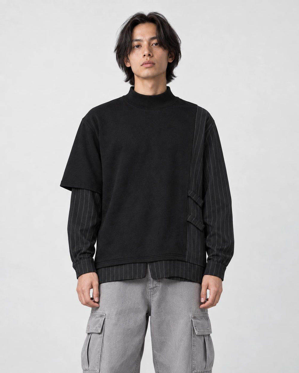 Model wearing the black pinstripe layered mock neck sweatshirt, front view