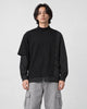 Model wearing the black pinstripe layered mock neck sweatshirt, front view