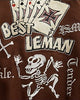 Close-up of the embroidered playing cards, BEST LEMAN lettering and skeleton on the back