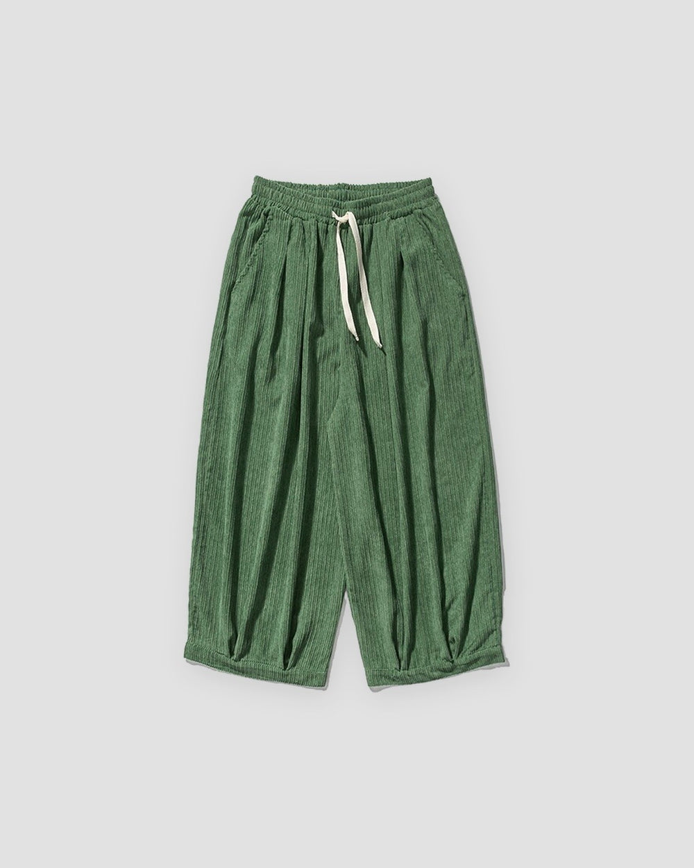 Green pleated corduroy wide-leg pants, front view, cream drawstring and gathered hem