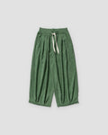 Green pleated corduroy wide-leg pants, front view, cream drawstring and gathered hem