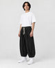 Model wearing the black corduroy wide-leg pants, three-quarter view
