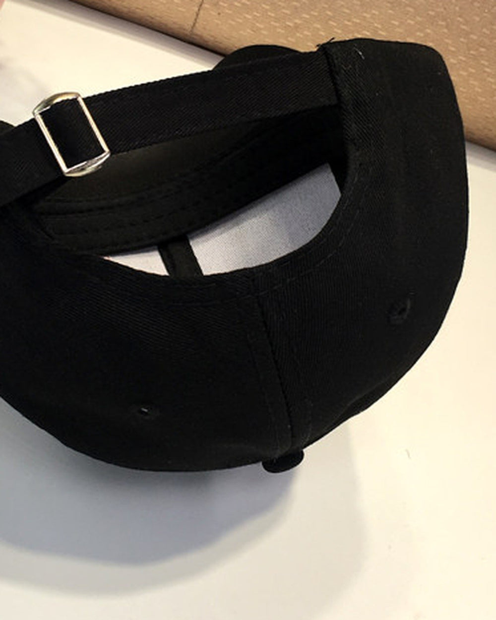 Close-up of the strap and metal slider at the back