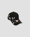 Black baseball cap with a pink plum blossom branch embroidered across the brim