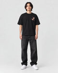 Model wearing the black plum blossom T-shirt, front view