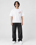Model wearing the white plum blossom T-shirt, front view with the chest sprig