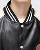Close-up of the striped rib collar and snap buttons on the baseball jacket