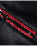 Close-up of a zip chest pocket with red piping