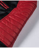 Close-up of the quilted red shoulder panel on the black jacket