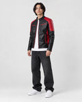 Model wearing the black and red PU leather moto jacket, three-quarter view