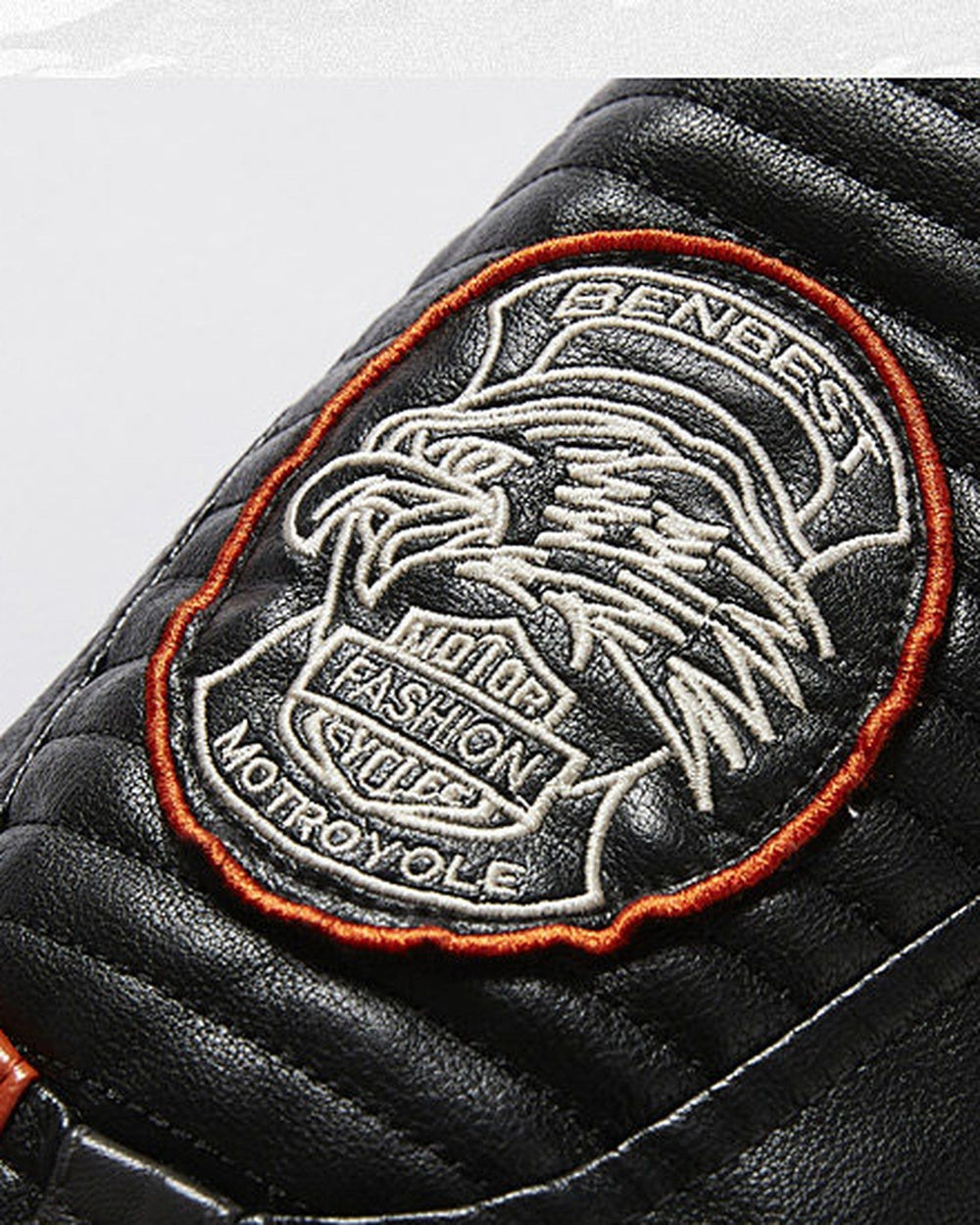 Close-up of the round embroidered eagle badge on the sleeve