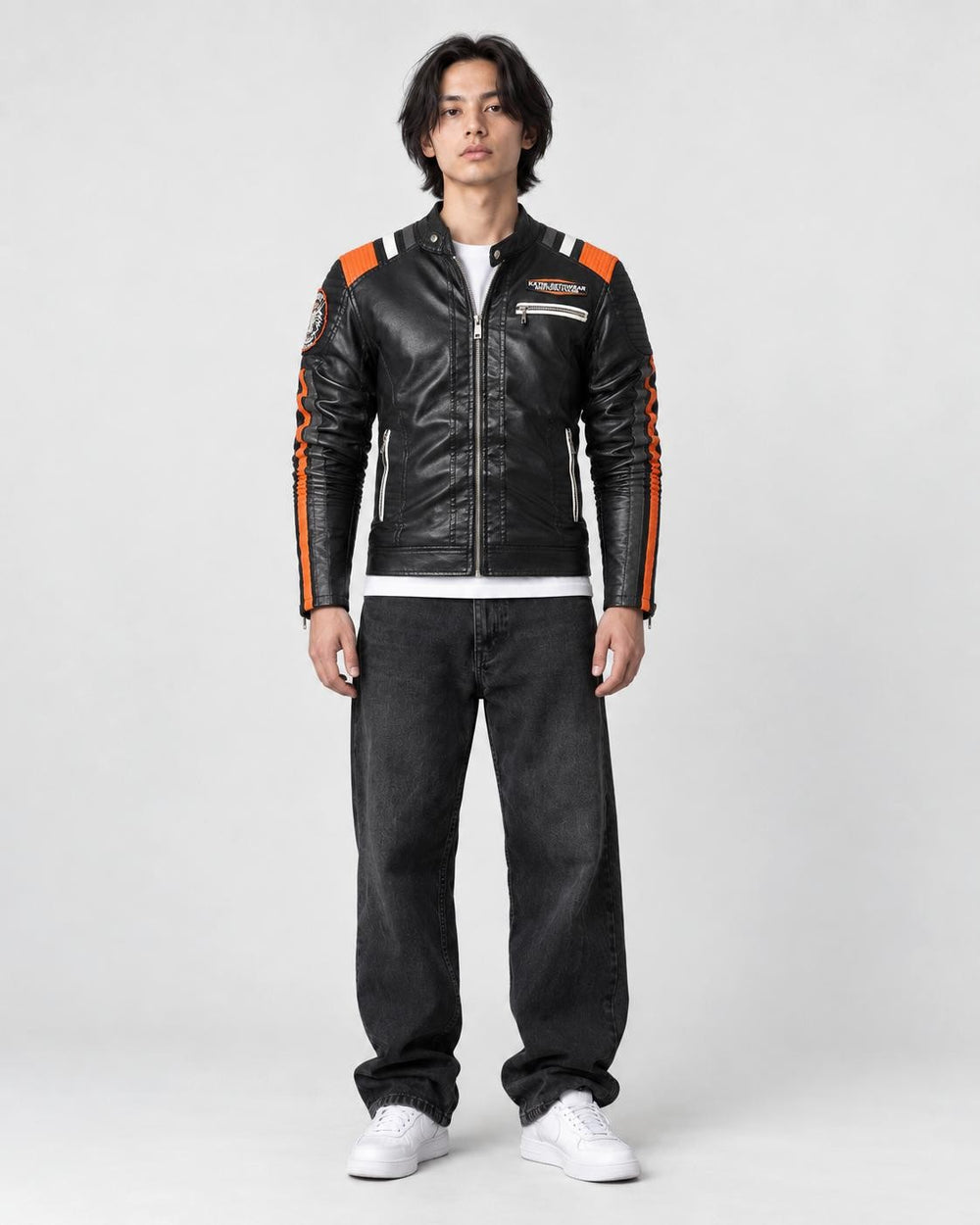 Model wearing the black racing stripe moto jacket over a white tee, front view
