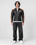 Model wearing the black racing stripe moto jacket over a white tee, front view