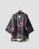 Charcoal haori cardigan with a white moon, ravens and purple spider lilies on a hanger, back view