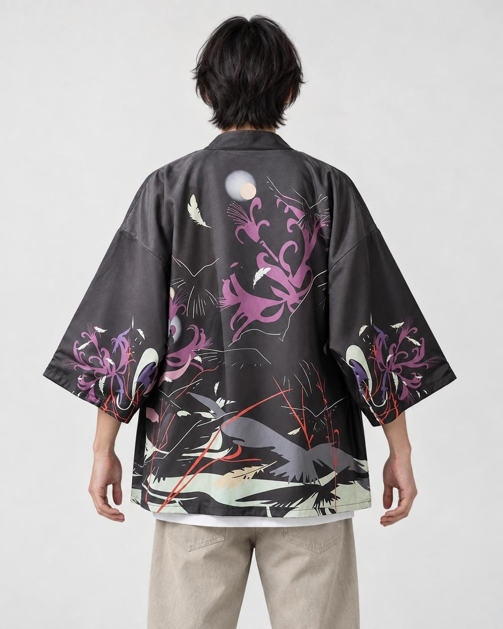 Model wearing the raven haori cardigan open over a white tee, back view