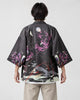 Model wearing the raven haori cardigan open over a white tee, back view