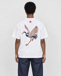 Model wearing the white crane embroidered T-shirt with dark jeans, back view