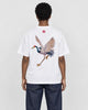 Model wearing the white crane embroidered T-shirt with dark jeans, back view
