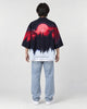 Full-length back view of a man in the haori with a red moon over a black pine forest fading to white, with light jeans