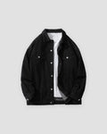 Black relaxed denim trucker jacket, front view, open over a white tee