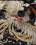 Close view of the phoenix embroidery in silver, cream and gold thread with red accents on glossy black fabric