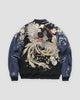 Back of the black jacket with a large silver and cream phoenix among cherry blossoms and navy raglan sleeves