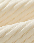 Close-up of the fine vertical ribs of the corduroy fabric