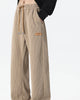 Khaki ribbed corduroy wide-leg pants with a tan drawcord and a tag at the hip
