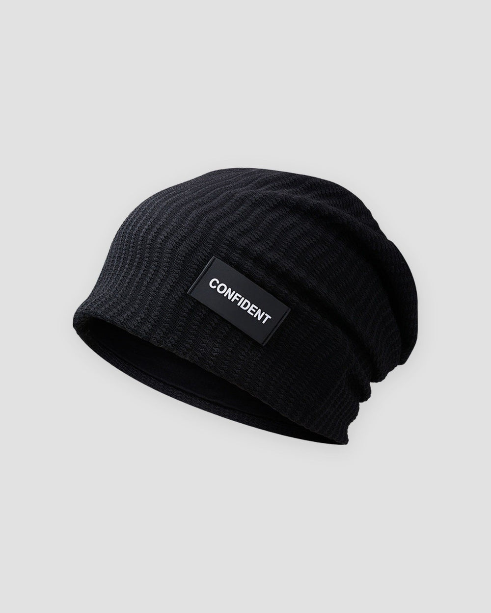 Black ribbed slouchy beanie with a small black label reading CONFIDENT