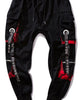 Flat view of the cargo pockets and the printed ribbon straps on the joggers
