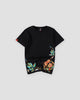 Black cotton tee with roses and teal leaves embroidered along the lower hem