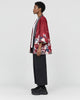 Model wearing the sakura print kimono jacket, red side out, side view