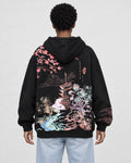 Model wearing the black sakura tower hoodie, back view of the print