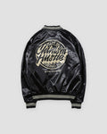 Black bomber jacket with a large round cream script badge on the back, back view