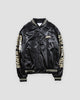 Black satin-like bomber jacket with cream sleeve lettering and striped rib trims, front view
