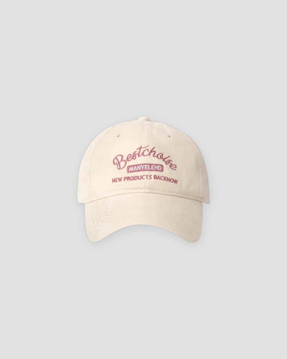 Beige washed dad cap with pink script embroidery, front view