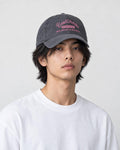 Model wearing the gray washed dad cap, front view