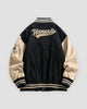 Black varsity jacket, back view, smaller script lettering on the upper back