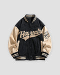 Black varsity jacket with beige sleeves, front view, cream script lettering across the chest