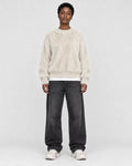 Model wearing the cream shaggy knit sweater, front view