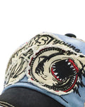 Close-up of the embroidered shark head with its open red mouth