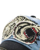 Close-up of the embroidered shark head with its open red mouth